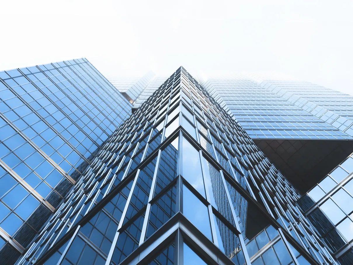 Glass office towers viewed from street level